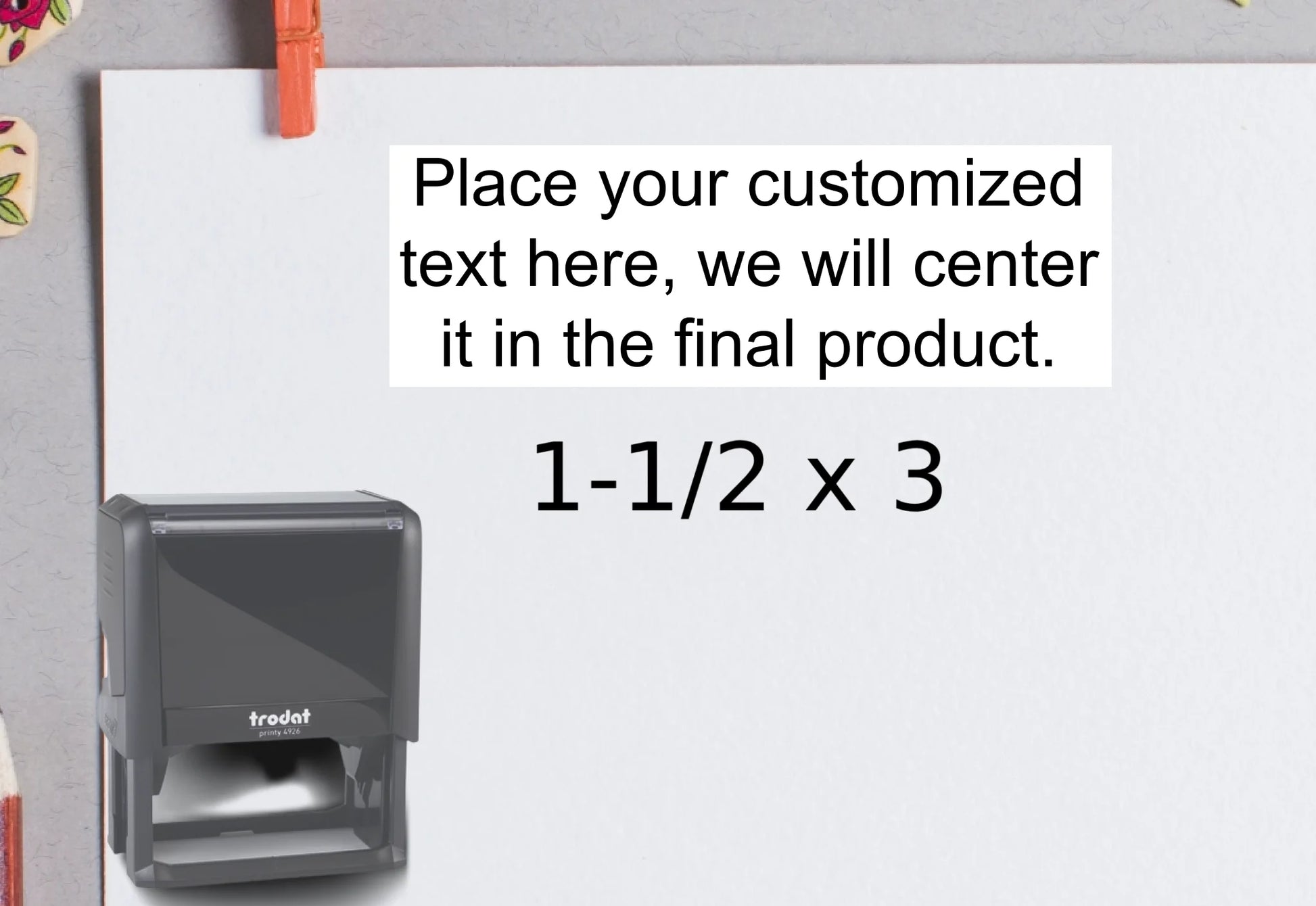 blank-white-page-with-clothes-peg-surrounded-with-stationeries-gray-background