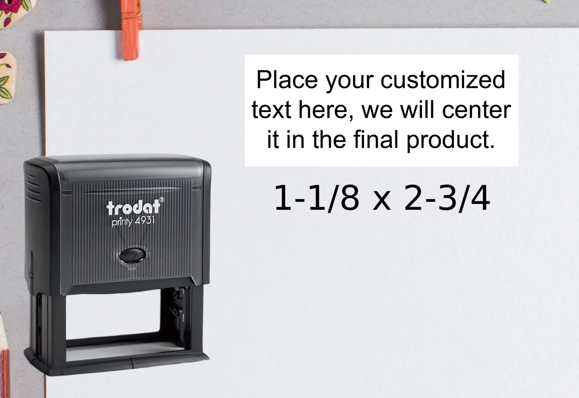 blank-white-page-with-clothes-peg-surrounded-with-stationeries-gray-background