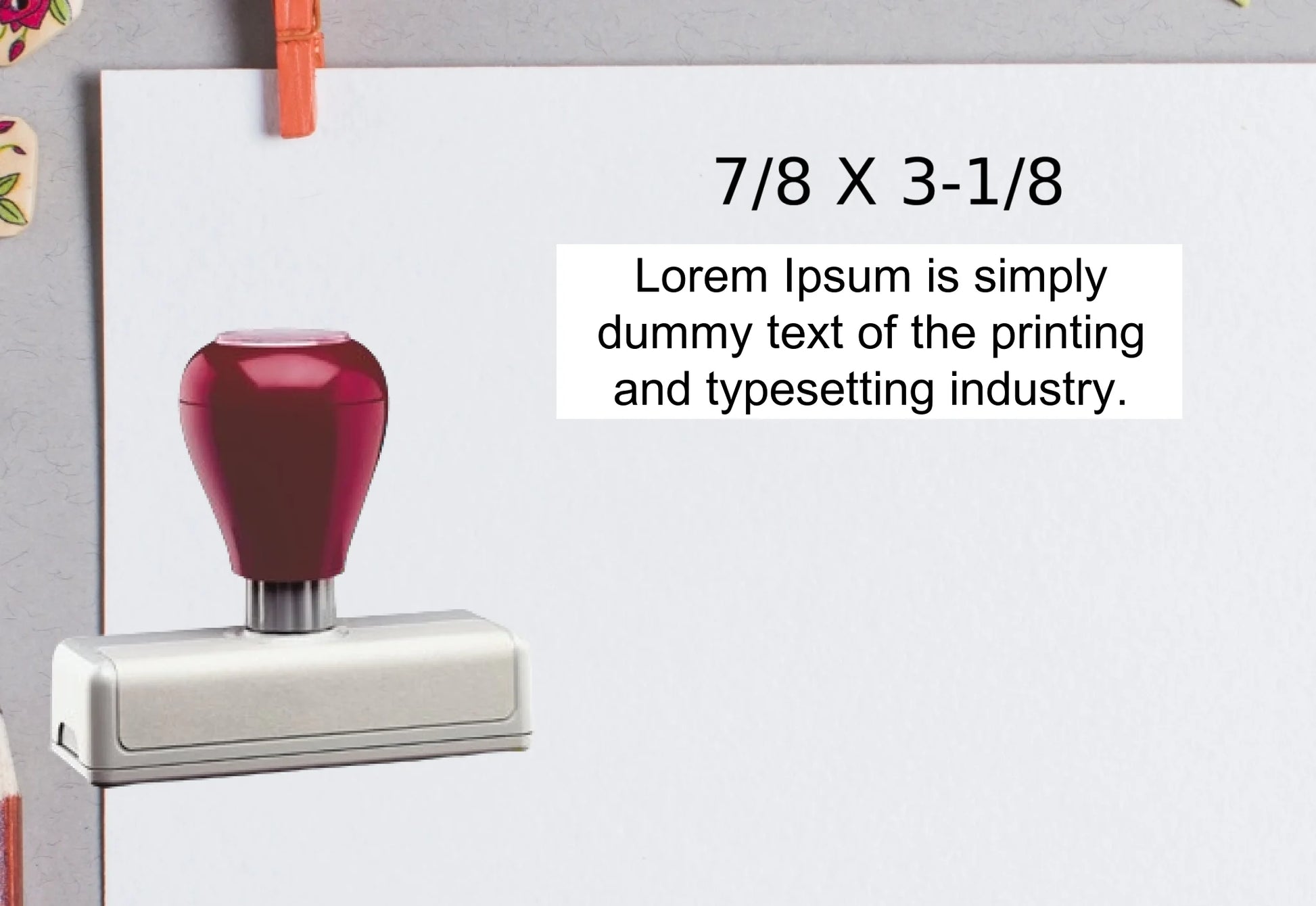 blank-white-page-with-clothes-peg-surrounded-with-stationeries-gray-background