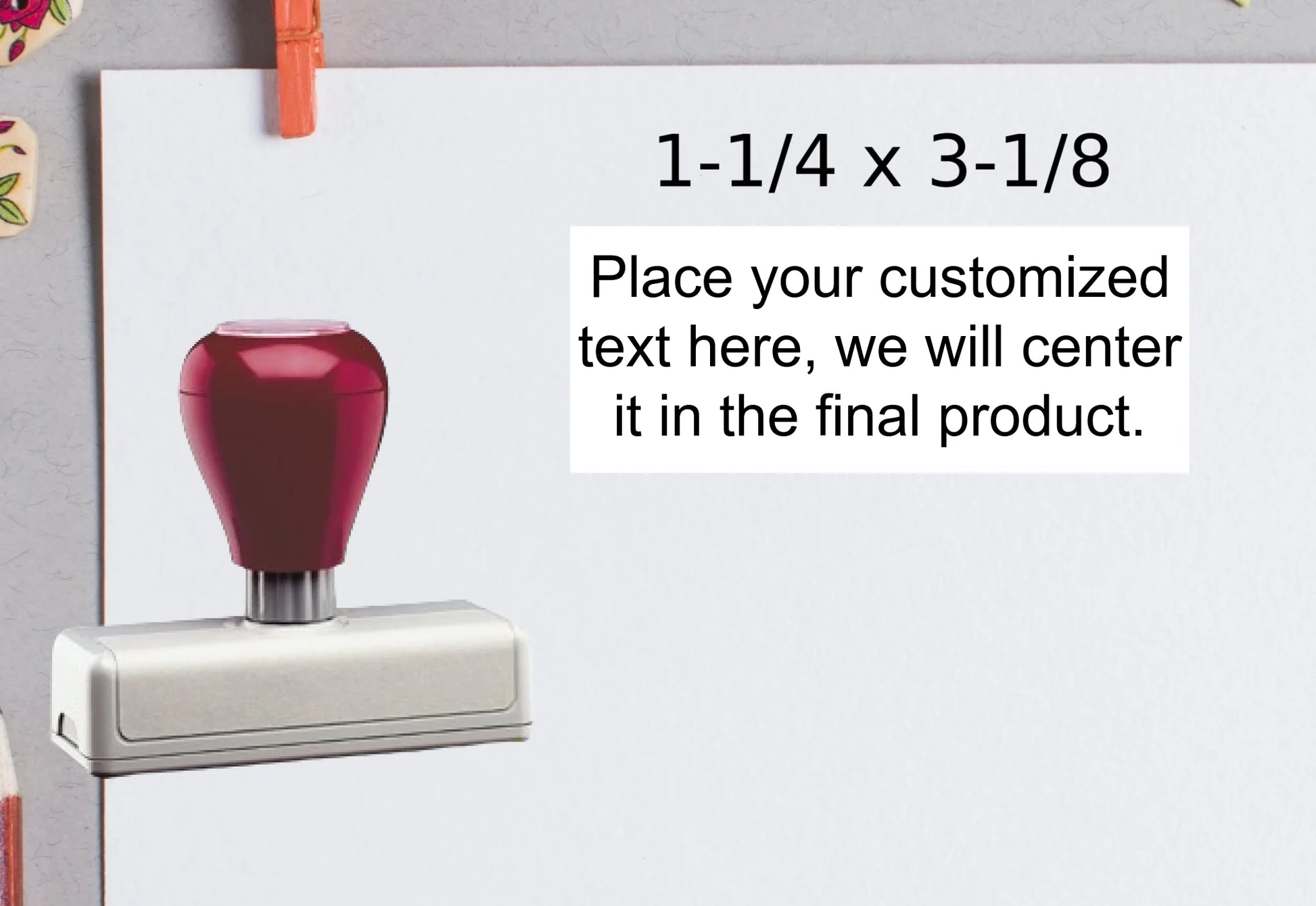 blank-white-page-with-clothes-peg-surrounded-with-stationeries-gray-background