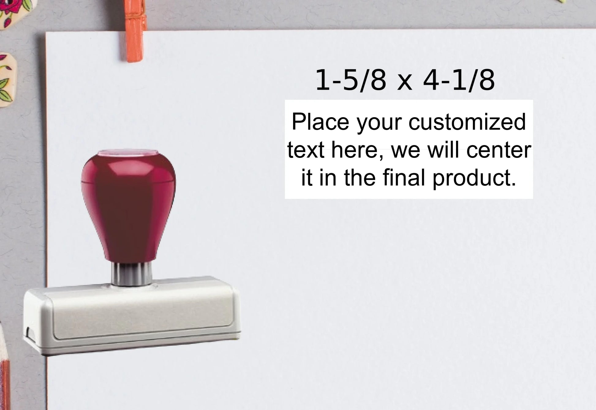 blank-white-page-with-clothes-peg-surrounded-with-stationeries-gray-background