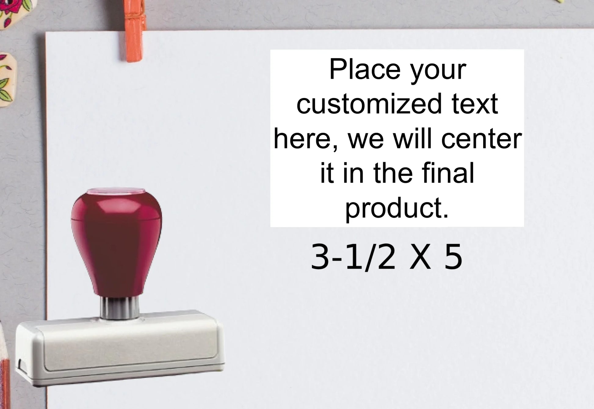 blank-white-page-with-clothes-peg-surrounded-with-stationeries-gray-background