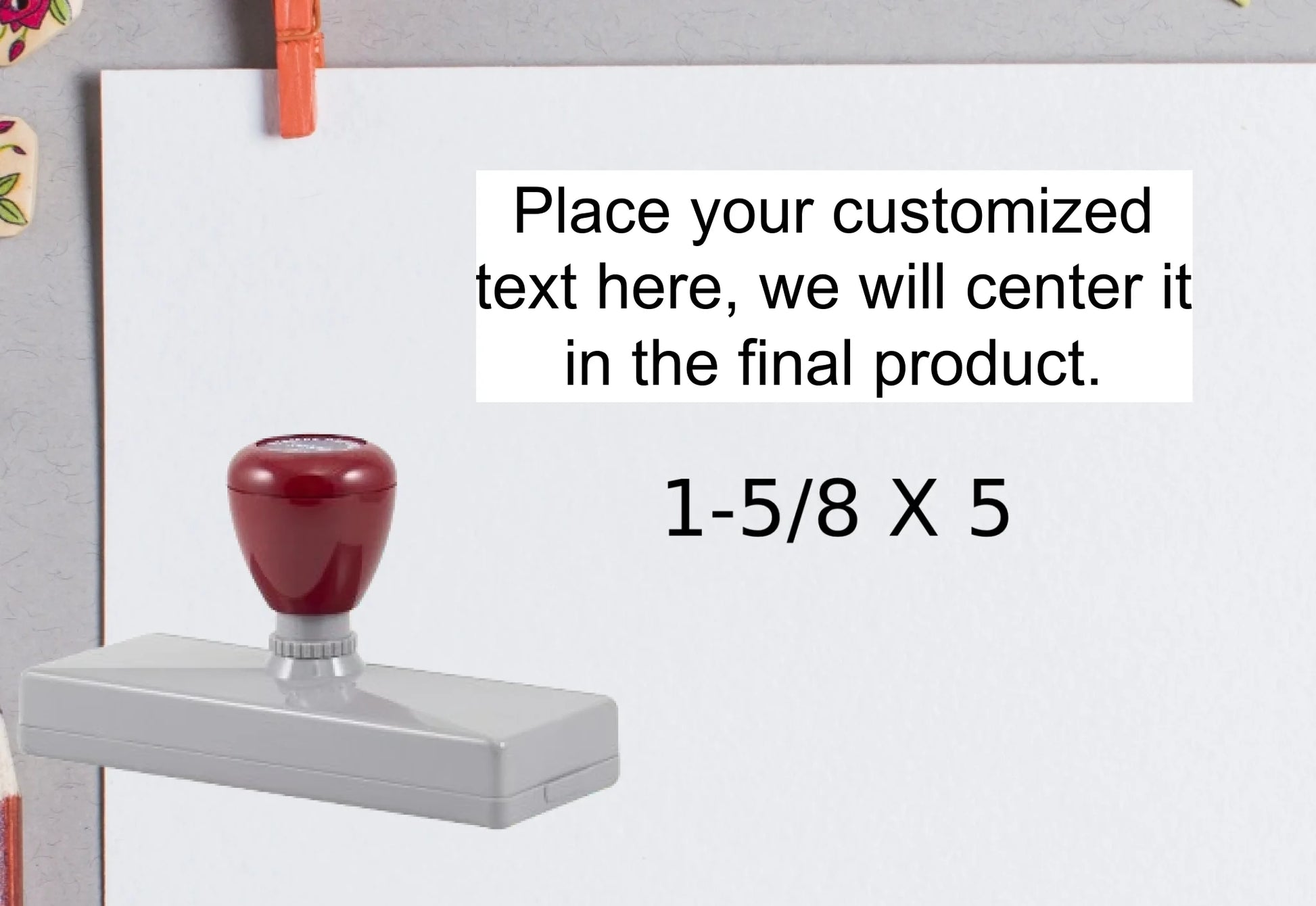 blank-white-page-with-clothes-peg-surrounded-with-stationeries-gray-background