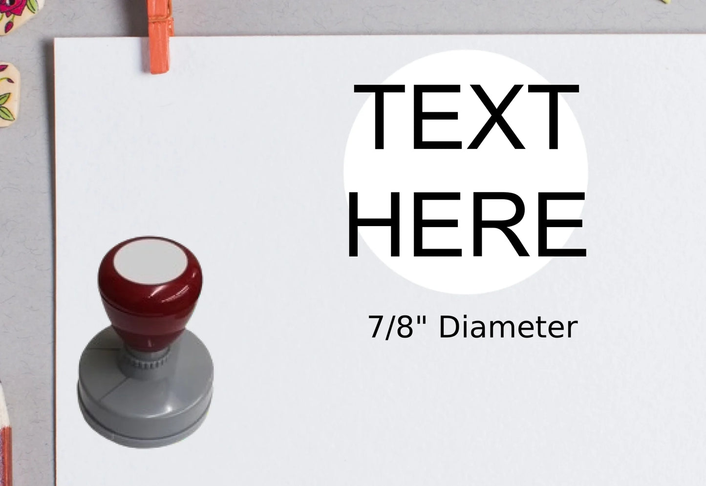 blank-white-page-with-clothes-peg-surrounded-with-stationeries-gray-background