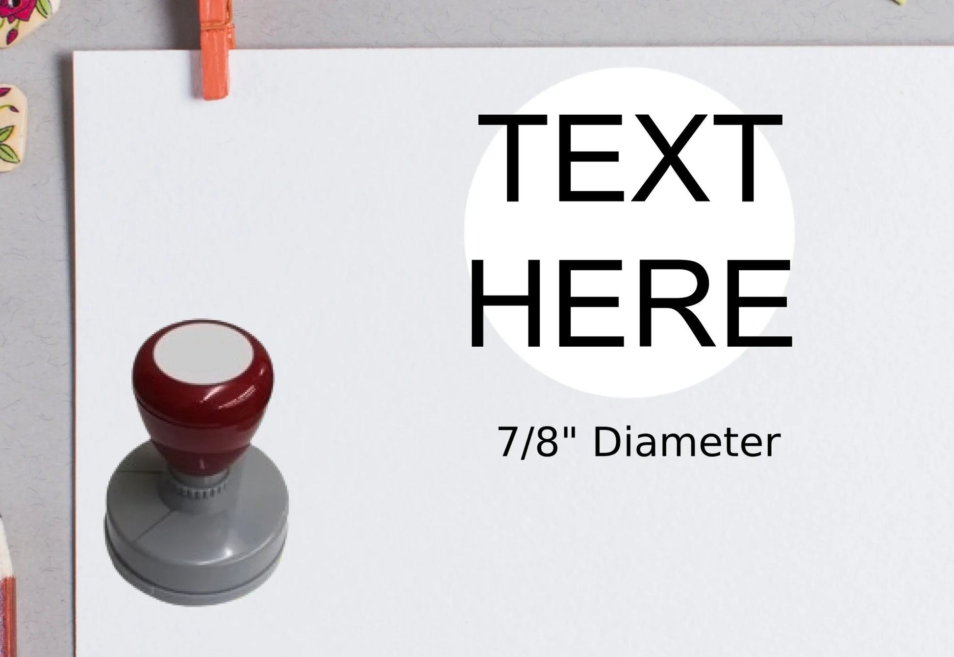 blank-white-page-with-clothes-peg-surrounded-with-stationeries-gray-background