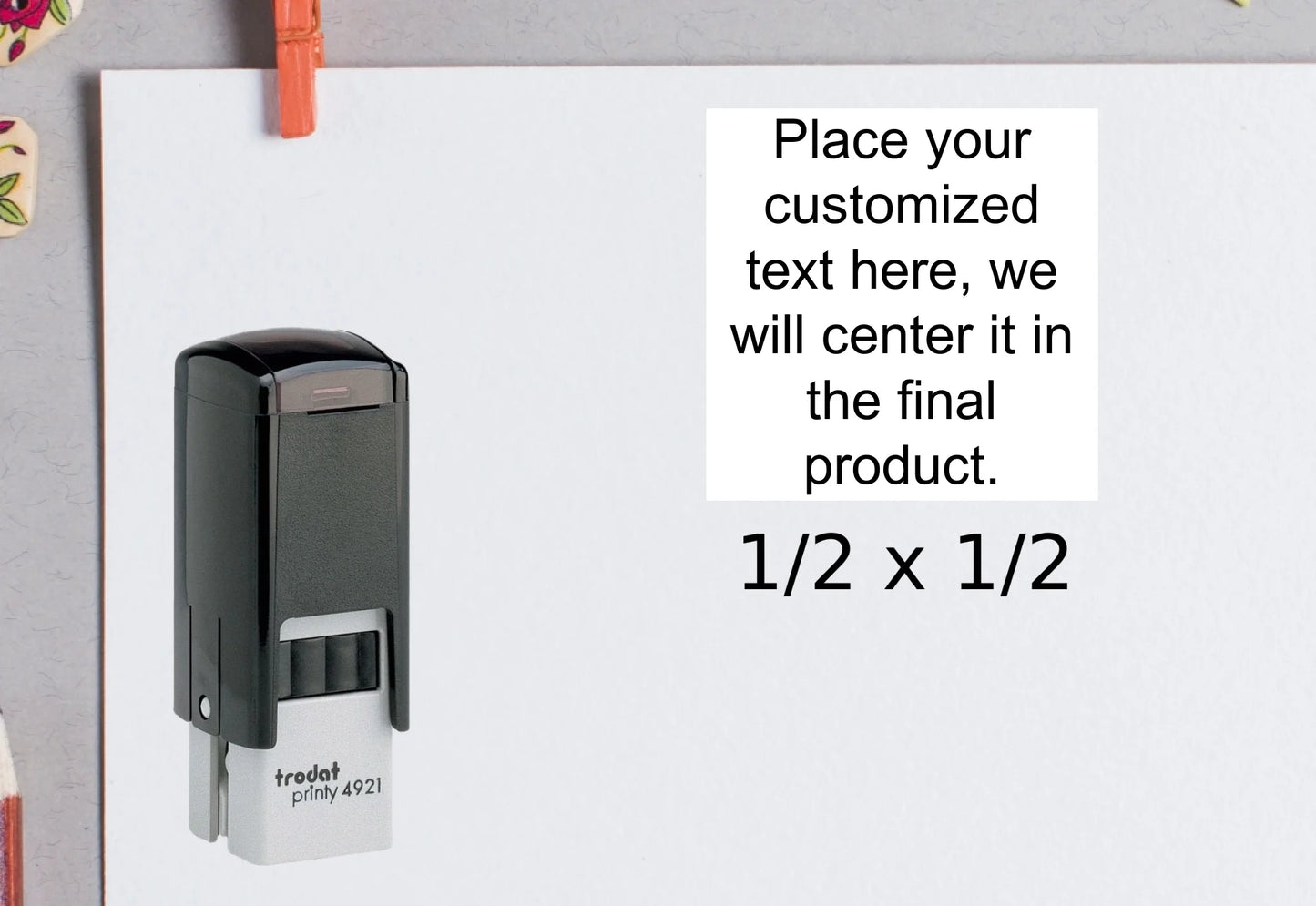 blank-white-page-with-clothes-peg-surrounded-with-stationeries-gray-background