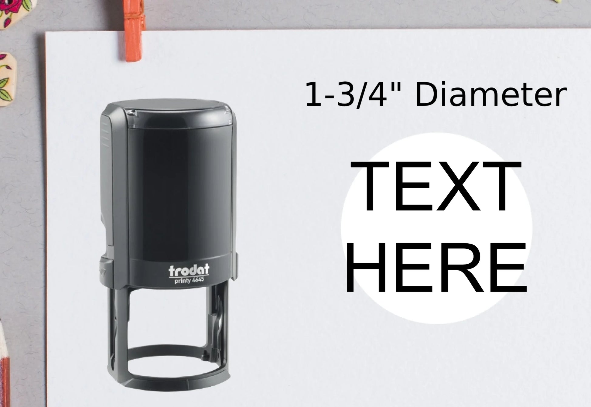 blank-white-page-with-clothes-peg-surrounded-with-stationeries-gray-background