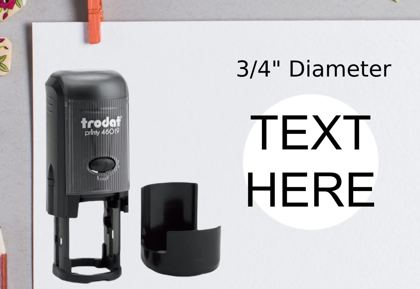 blank-white-page-with-clothes-peg-surrounded-with-stationeries-gray-background