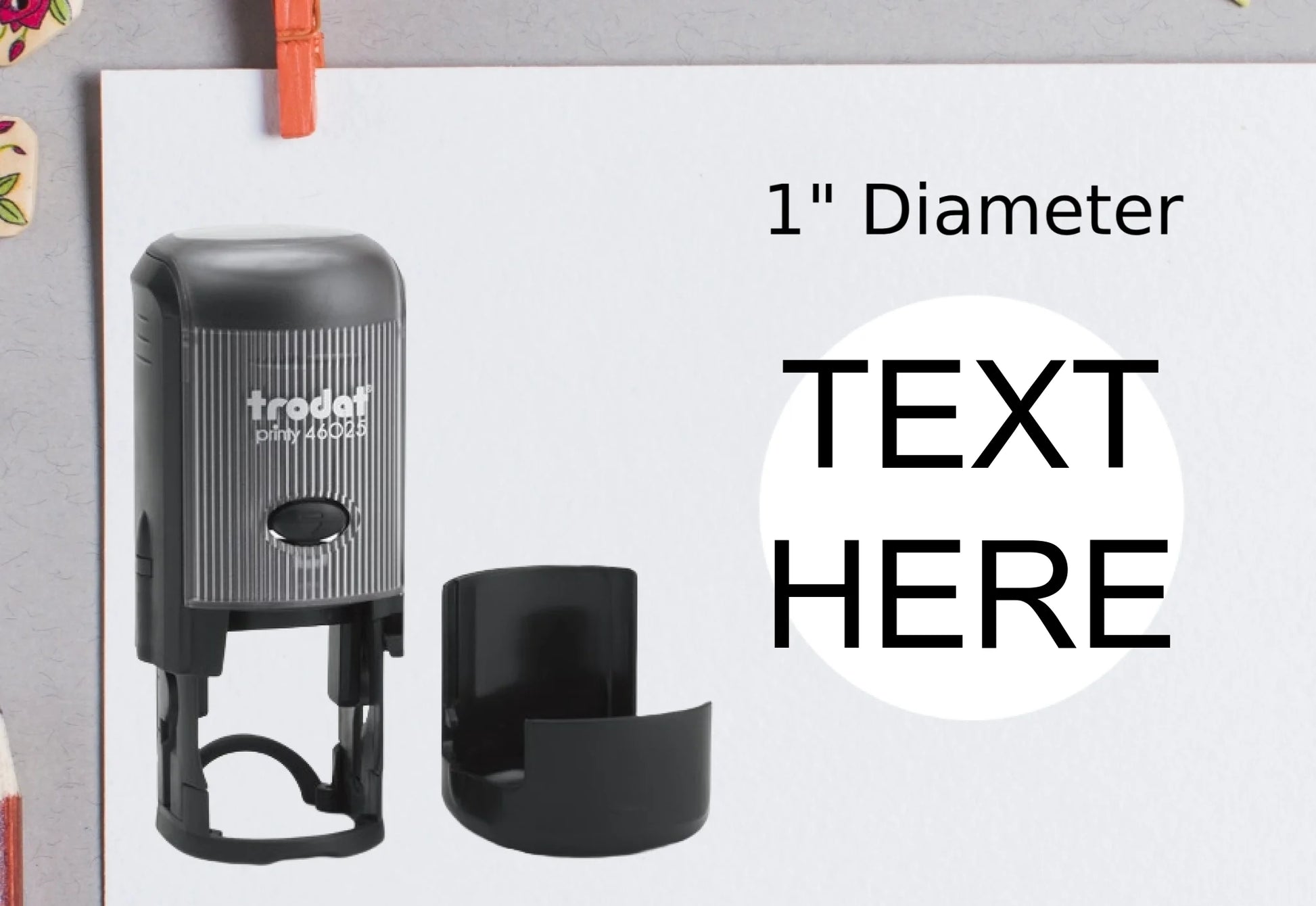 blank-white-page-with-clothes-peg-surrounded-with-stationeries-gray-background